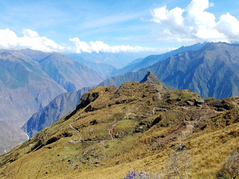 This photo was taken from a bit higher than the pass. You can see the trail we were on as well as a small rest area.