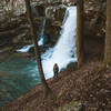 Travel companion looking at the third of three waterfalls that can be seen along the gorge trail at Cloudland State Park.