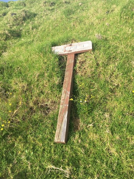 Last marker before reaching fence laying on the ground at a Y in the road. I went left. When you come to the tall fence follow it up and to th right to an unmarked gate.