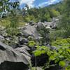 At the base of the ice beds. The ice is under the boulders.