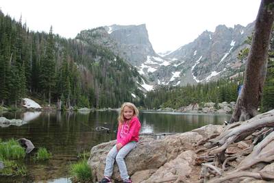 My daughter resting by Dream Lake in July 2017.
