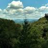 The Diablo Range in the far distance across Santa Clara Valley, comes into view beyond Santa Cruz Mountains as one climbs Knobcone Trail.