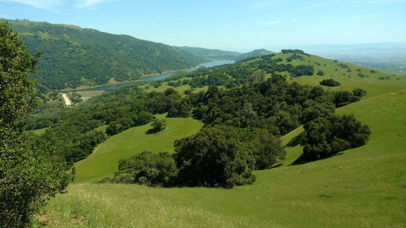 Left to right - Palassou Ridge, Coyote Lake and dam, Coyote Ridge, and southern Santa Clara Valley with central California in the far distance, looking southeast from the high point of Ed Willson Trail.