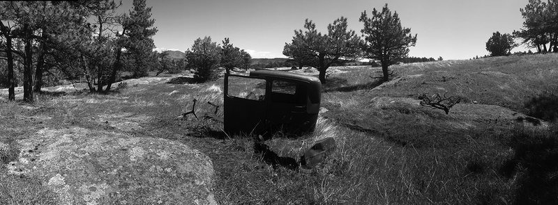 Abandoned car body near homestead