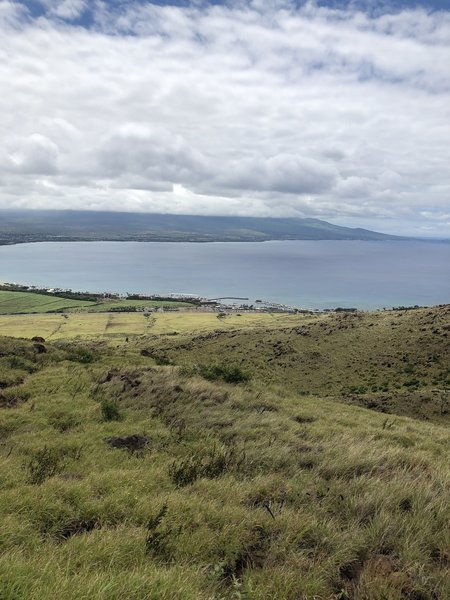 Close to the crest of the trail, looking out towards Kihei and Haleakala National Park (obscured by clouds).