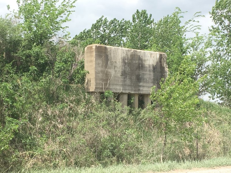 Old railroad bridge that was pulled down. The trail continues to the right of this bridge.