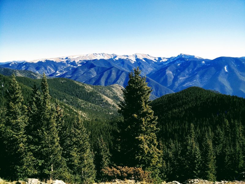 The snow-covered peaks of the Taos Ski area, as seen from Lobo Peak