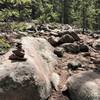 Cairns. These small piles of purposely stacked rocks mark the trail in this section. Pretty typical of what you'll find along most of the route to the summit.