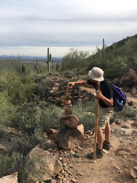 Topping off a cairn on the Pass Mountain Trail.