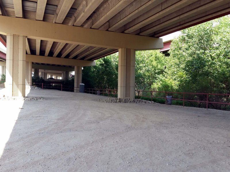 Parking, restroom, trash cans under the overpass