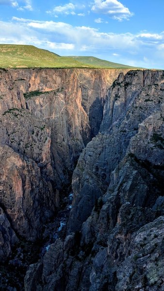 A wonderful contrast between the depths of the Black Canyon of the Gunnsion and the grasslands and blue skies above.