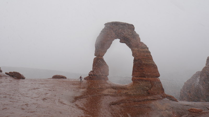 Rain and snow at Delicate Arch in February.