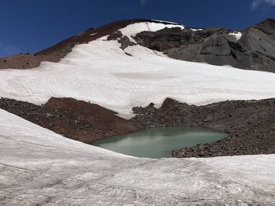 Tarn at the base of Lewis Glacier