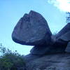 Floating rock partway up the rock scramble to summit .