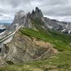 Beautiful view of outcroppings and distant mountain views from the summit of Seceda.