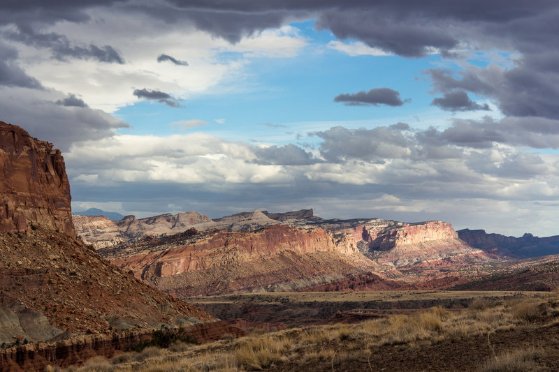 Blue sky above the Waterpocket Fold on an otherwise cloudy evening