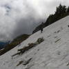 Climbing up a snow bank to the trail.