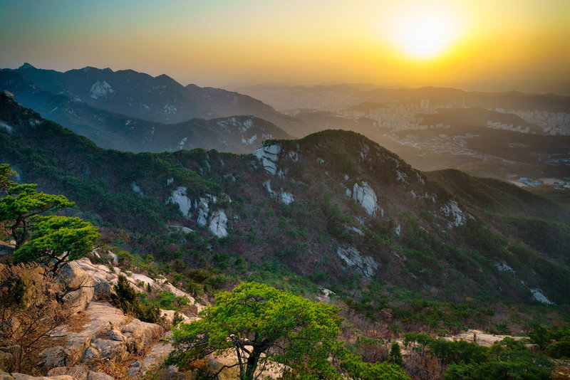 Sunset over Seoul on the northern ridge of the trail. The nearest ridgeline is the first half of the trail.