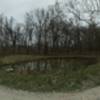 The road does not actually bend, this is a panoramic shot of Walt's Pond.