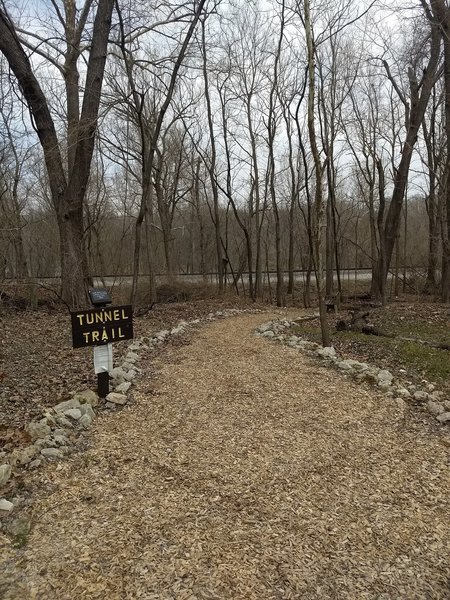 Trailhead that will take you under the train tracks down to the river