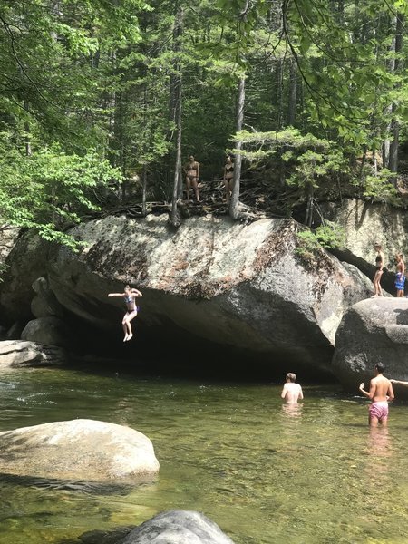 Jumping into swimming hole along Franconia Falls Trail