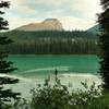 Fishing in Brazeau Lake at sunset. Brazeau Lake is a large backcountry lake in southern Jasper National Park.