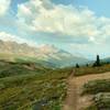 The rolling meadows around Pobotkan Pass with mountains to the southwest in the distance beyond stream valleys.