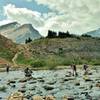 Now what? - Crossing the Brazeau River just below Nigel Pass. Two on the left take off their boots, three on the right rock hop it.