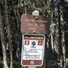 This is the trail sign to find for the easiest access to the start of the trail.