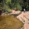 Small pool with natural rock slide.