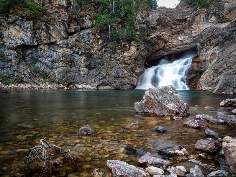 Running Eagle Falls (low flow, August) as the day turns to dusk. Near Two Medicine Lake.