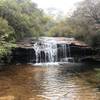 A small waterfall on the walk - has a nice sandy area to walk on.