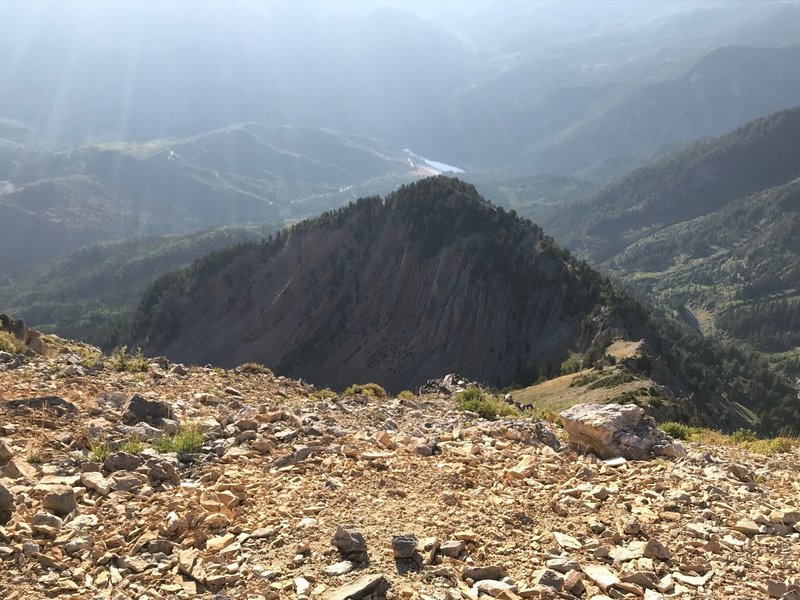 A cool rock formation just below the summit of Box Elder, with Tibble Fork Reservoir down below
