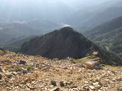 A cool rock formation just below the summit of Box Elder, with Tibble Fork Reservoir down below