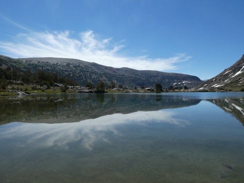 Heading along the east side of Saddlebag Lake in the morning, full of reflections when the wind isn't blowing.