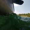 Water crashing up against the canoe.