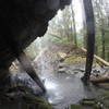 In the cave behind the upper falls.