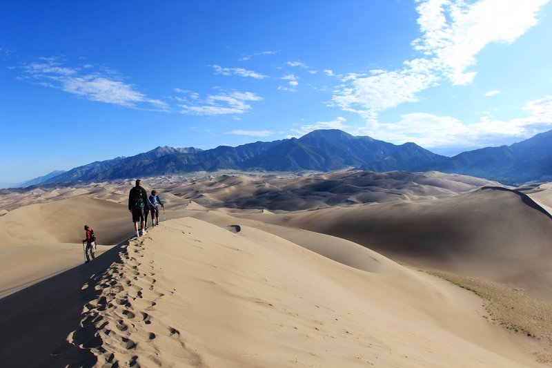 Group of hikers heading to Star Dune