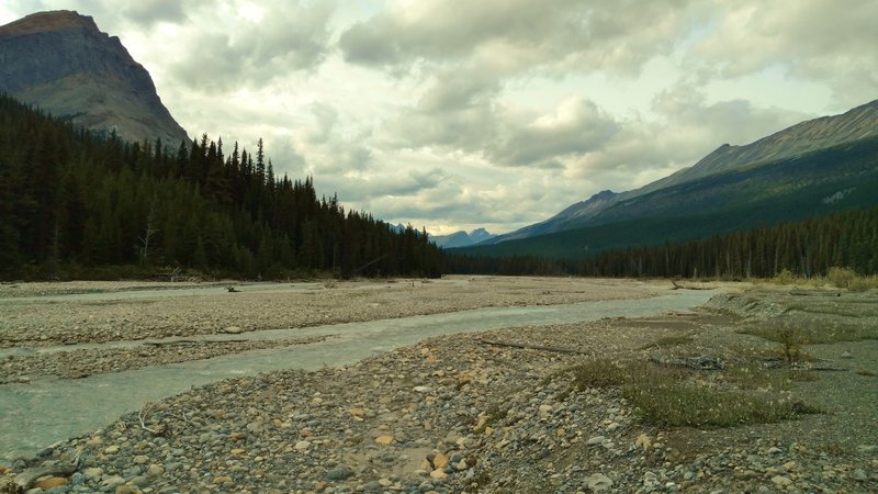 The Smoky River spread out across gravel flats, making for a lower water level, and therefore, easier ford. Seen looking downstream (northwest) from the northeast river bank, at the alternate Smoky River crossing.