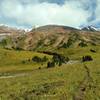 Looking northeast, left to right - Calumet Peak, low ridge, ridge forming north side of Moose River valley descending southwest from Moose Pass, with the headwaters of Calumet Creek in the foreground, seen from the trail just west of Moose Pass.