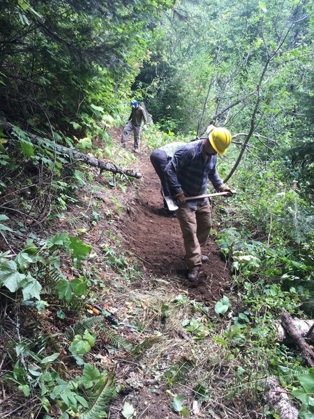 BMLT Blues Crew repairing the slope of the trail.