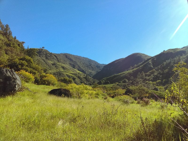 The Guayabal river runs through this beautiful mountains that occasionally open just enough to create small valleys