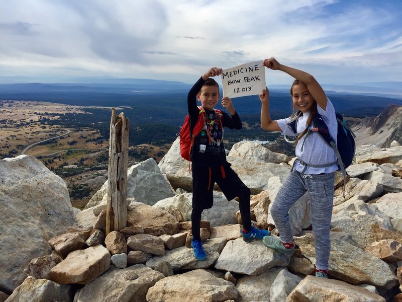 There was a sign for us to take a picture with at the summit of Medicine Bow Peak 12,013' 09/03/18 (Kids aged 12 and 9)