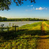 A small bench provides a great place to enjoy some bird watching next to Deaver Pond.