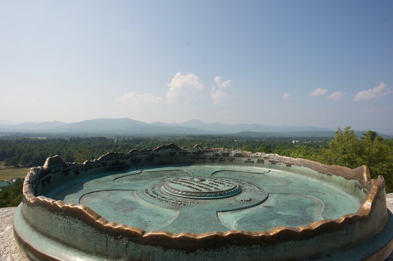 The monument to Robert Peary at the top of Jockey Cap has a profile of the surrounding hills, mountains, and lakes in the area.  It's a great way to identify what is in front of you.