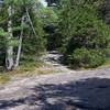 The trail crosses solid rock for a while, with blazes painted on the rock to show the way.