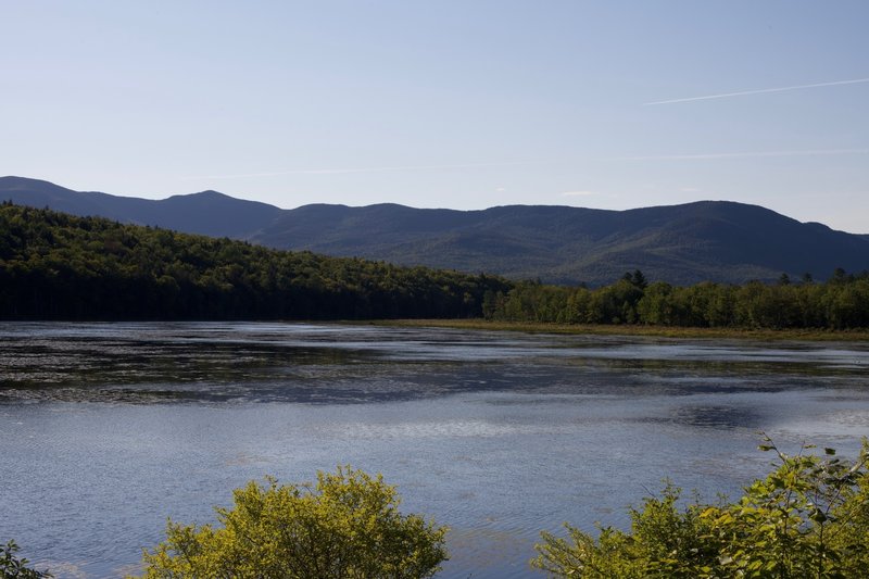 From a small bench on the side of the trail, the best view of Shell Pond and the surrounding mountains spreads out before you.