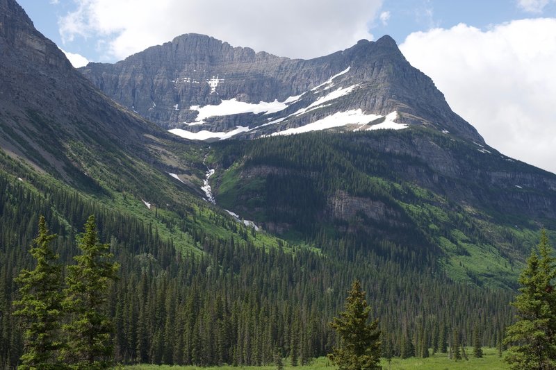 In the spring, snow still clings to the mountains. The views open up as you approach the Saint Mary River.