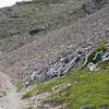 As the trail climbs, you leave the woods behind and begin making your way through scree fields.