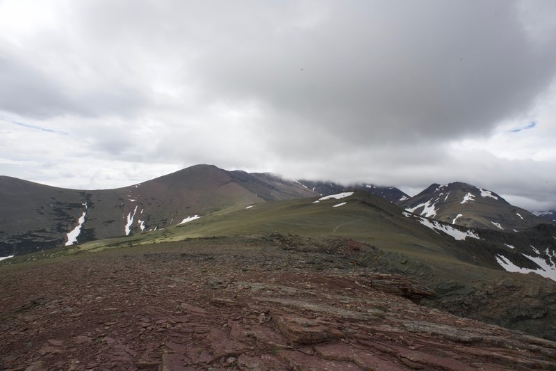 You can see the trail leading off into the hills as the clouds roll in.  This is the view back toward the trail from Scenic Point.